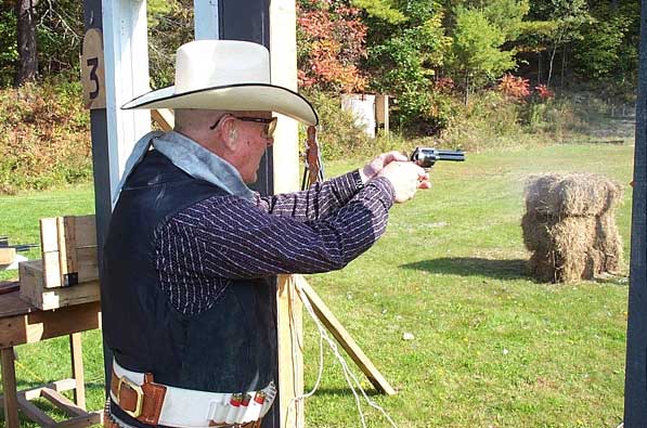Working his pistol at the Outlaw Revenge Shoot in Falmouth in October 2004.