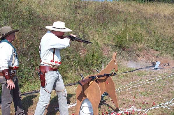 Bullseye Bade stuffing his 1897 shotgun.