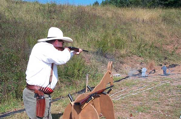 Shooting his double on some knockdown targets.