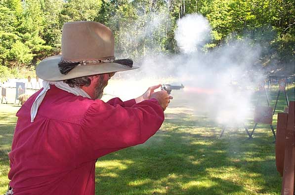 Shooting pistol at the 2004 SASS Maine State Championships.