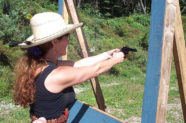 Shooting pistol at the 2004 SASS Maine State Championships.