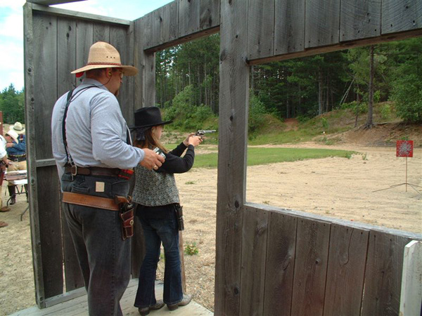 Another shot of shooting her pistol.