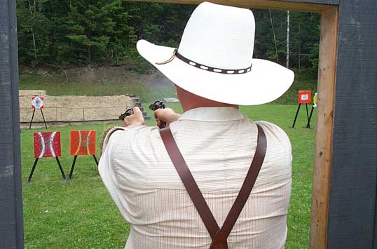 Bullseye Bade shooting gunfighter-style at August 2003 Falmouth Shoot.