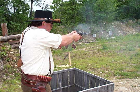 Sue (with new hat) shooting pistol at the 2003 Flat Gap Jack Cowboy Shootout.