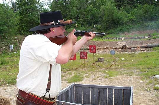 Sue (with new hat) shooting rifle at the 2003 Flat Gap Jack Cowboy Shootout.