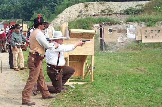 Shooting pistol from one knee at 2003 NH State SASS Championships.
