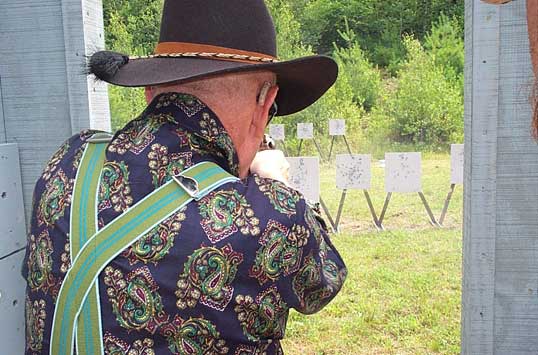 Shooting pistol at 2003 NH State SASS Championships at Keene, NH.