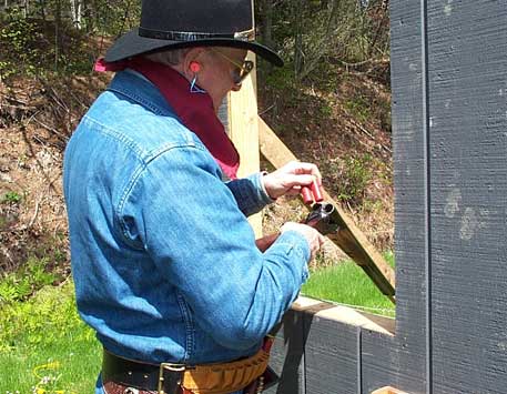 Stuffing the double barrel shotgun ...