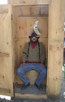 Paden in the outhouse and smiling.