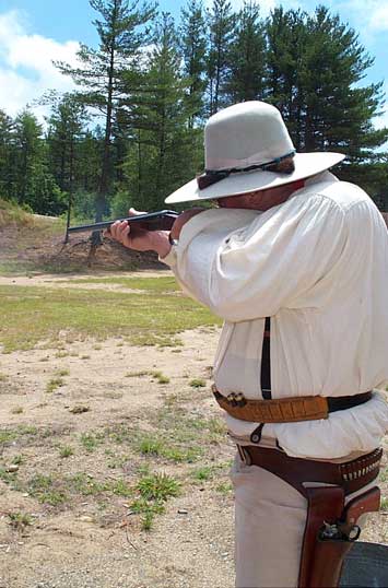 Jake shooting shotgun left-handed at 2003 Fracas at Pemi Gulch.