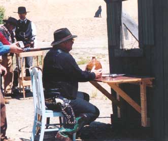 Single Action hugging the jug of U. B. Mountain's Dew.