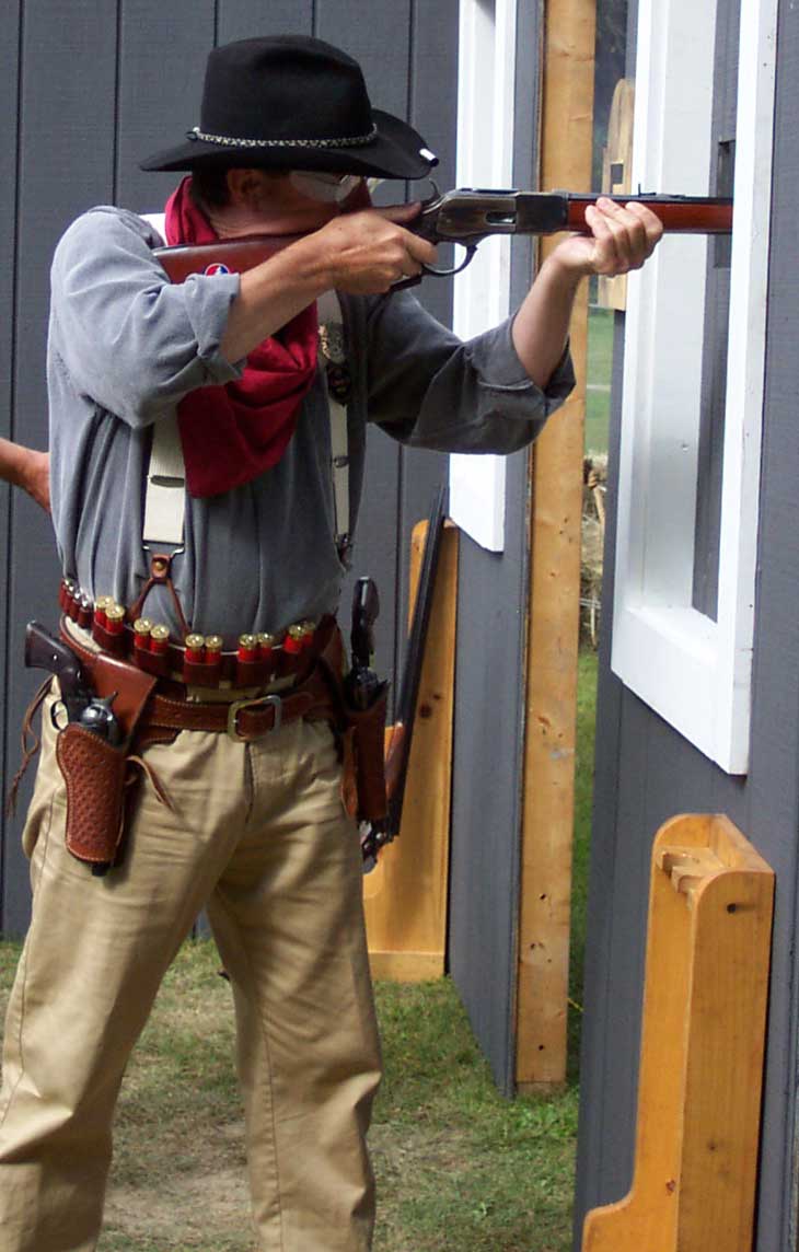 Shooting his Winchester 1873 rifle.