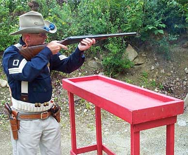 U B Mountain shooting shotgun at Dalton Shoot in late July 2002.