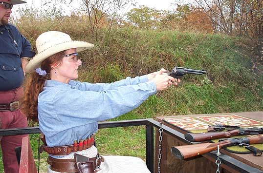 Angel Mountain shooting pistol while seated in the train.