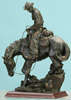 11.5 inch cowboy on walking horse.