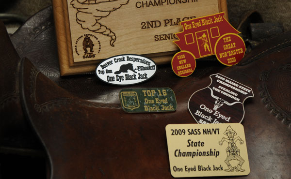 Image of laser engraved wood plaque and badges.