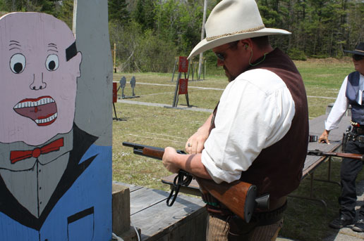 Loading his 1887 lever shotgun ...