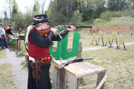 Belle Evans shooting rifle.