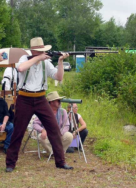 Shooting his Springfield Trapdoor Rifle.