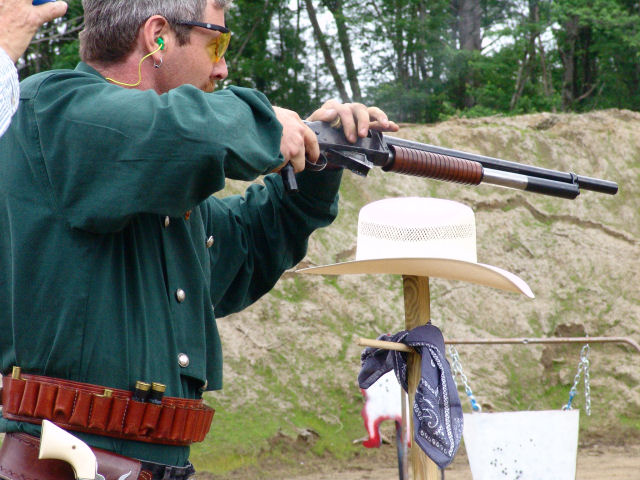 Stuffing his 1897 Winchester shotgun.