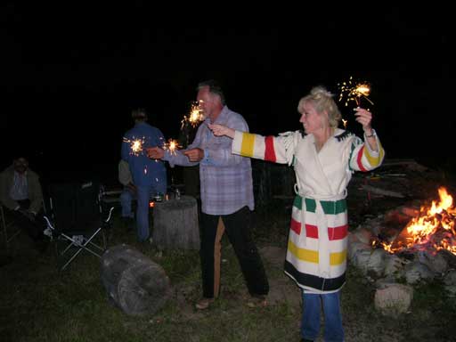 Capt Morgan Rum and Karrie Kay do the Great Buffalo Sparkler Dance around the bonfire on Saturday night.