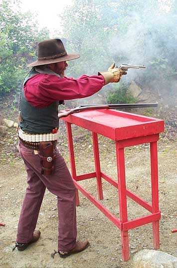 Shooting pistol at the Dalton Shoot in late July 2002.