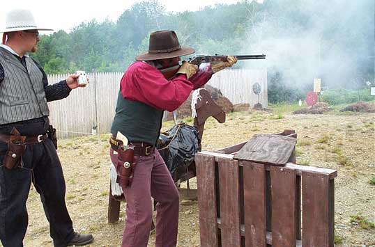 Shooting rifle while being timed by Jake Mountain.