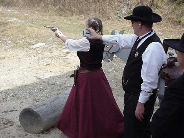 Dakota Miss cocking her revolver at Dalton, NH.