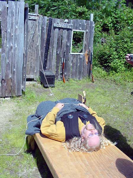 Sleeping in his cabin and about to be woken up.