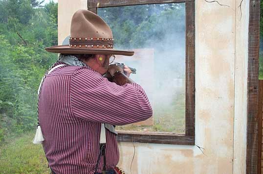 The Lazarus Man shooting rifle at the Flap Jack Gap Cowboy Shootout.