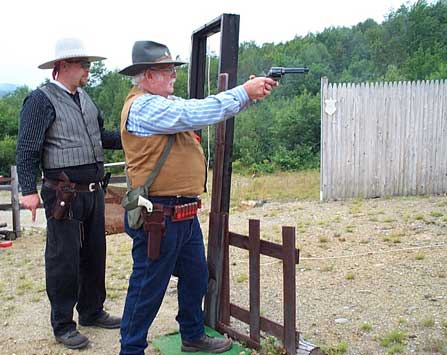 Shooting pistol at Dalton while being timed by Jake Mountain.