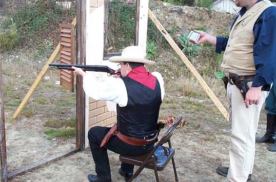 Dead Head shoting shotgun from chair.