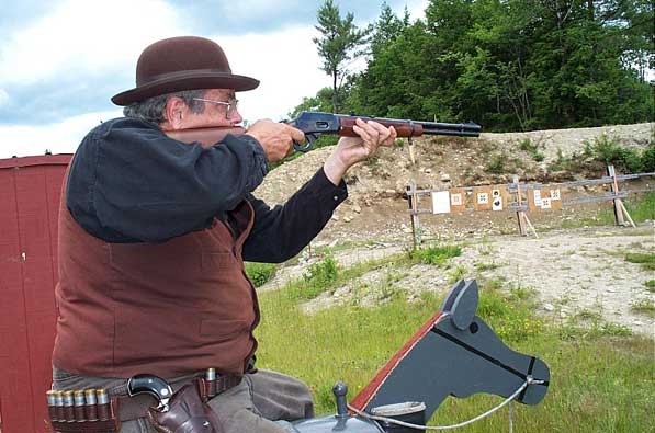 Shooting rifle off the horse in Keene, NH in June 2004.