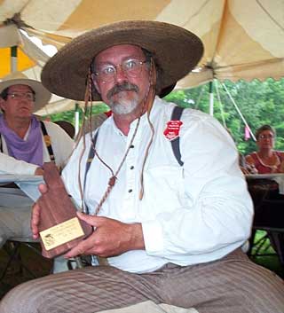 ... and with his trophy plaque from the 2003 NH State SASS Championships.