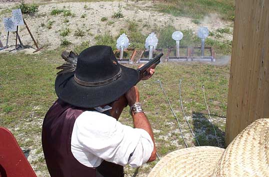 Blasting some varmits with his Winchester 1897 shotgun.