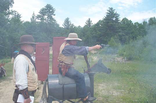 Dead Head blazing away from his horse.