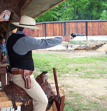 Taking aim while on his trusty steed ...