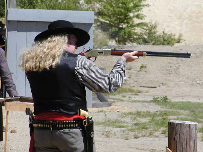 Shooting rifle at 2002 NH State Cowboy Action Shooting Championships.