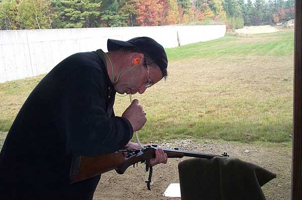 Ron Orcutt using a blowtube to keep the blackpowder fouling soft and moist between shots.